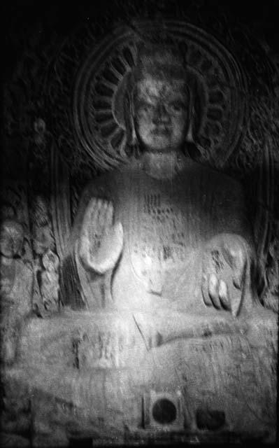 Ornate carving of Buddha or Bodhisattva