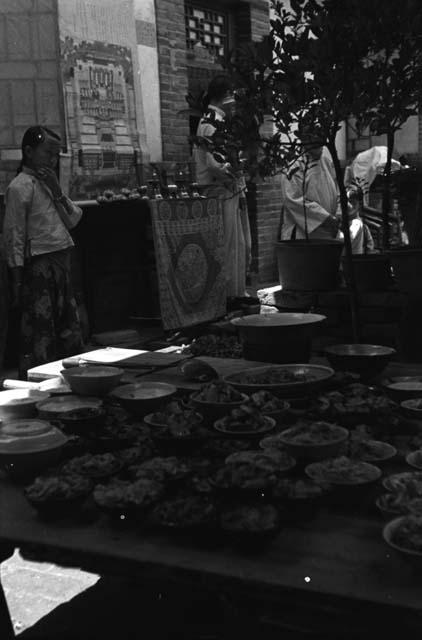 Yutaoho, Shansi, July 1935, wedding dishes, girl, and family tree, in background