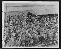 Group of men in hats in front of building