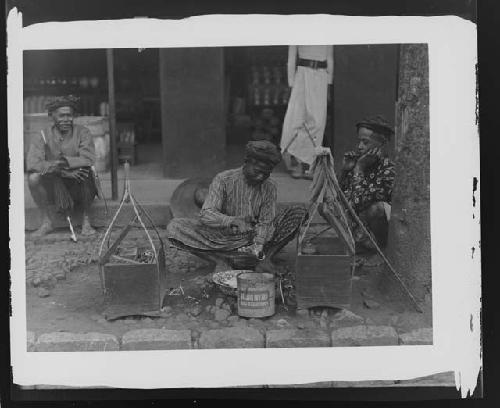 Man crouching near tools