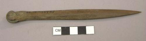 Sharpened animal limb bone. Bone tool, metapodial.