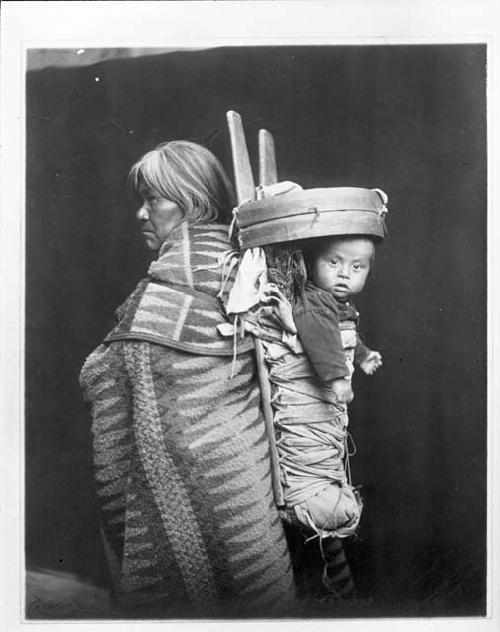 Navajo Indian woman with baby in cradleboard