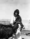 Shammar Bedouin boy and goat at Jumaima