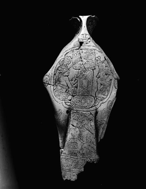 Peccary skull - incised bone, with cinnabar pigment rubbed into design