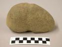 Ground stone tool with groove from wear