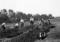 Men digging initial sounding trenches