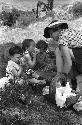 Yutaoho, Shansi, July 1935, David, Clare, Ann eating in row at picnic