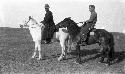 Portrait of two men on horseback