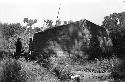 Yutaoho, Shansi, summer 1935, cruciform human effigy of straw on house-gable