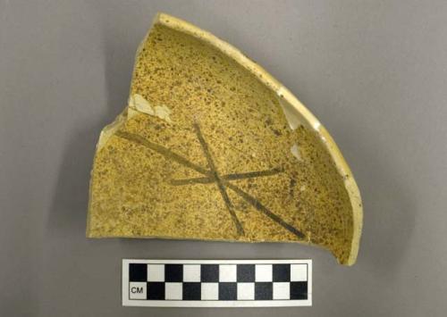 Restored black-on-yellow potsherd