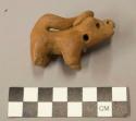 Pottery figurine; animal with tail on head
