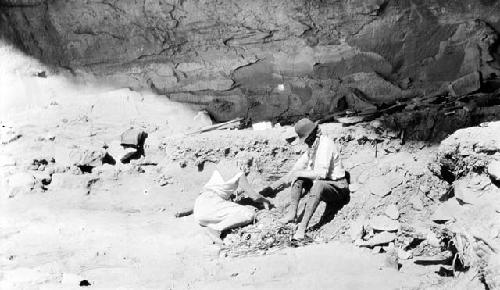 Kidder digging on mountainside