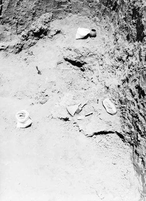 Grave excavation showing pottery jar fragments in pit 7; Grave 1