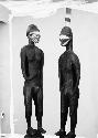 Male and female wooden effigies