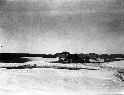 Camp, ruined inn, tent set up in snowy plain