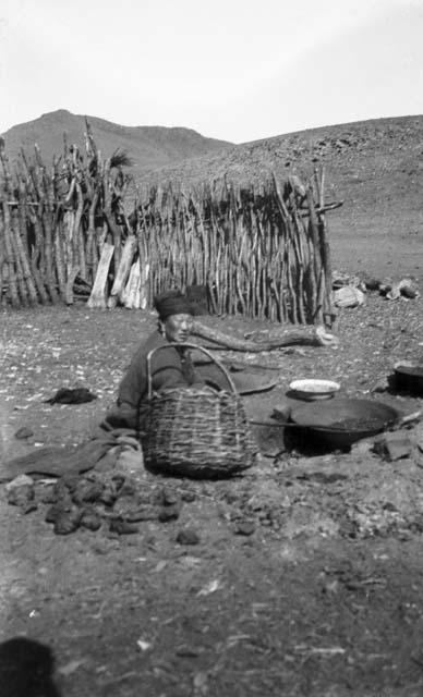 Mongol woman cooking on argol fire