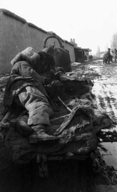 Kazak (Qazaq) lying on sledge
