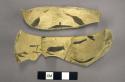 Fragments of black on yellow pottery bowl