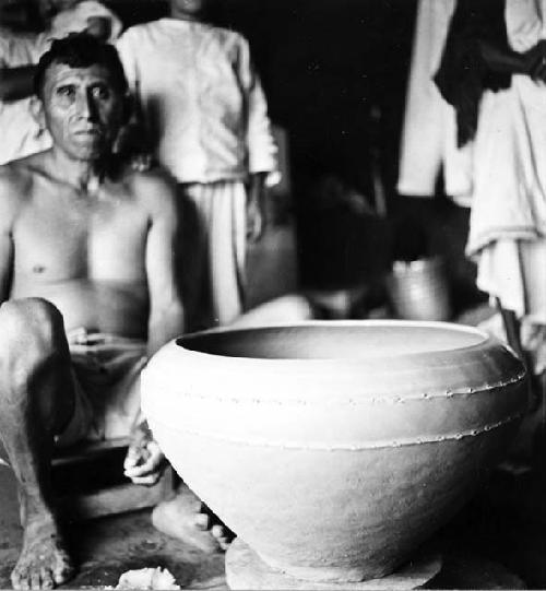 Modern pottery making - resting on a kabal which in turned by the hands or feet