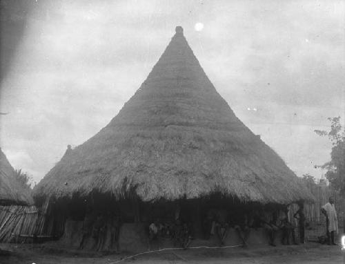 Men gathered outside of palaver house, public house