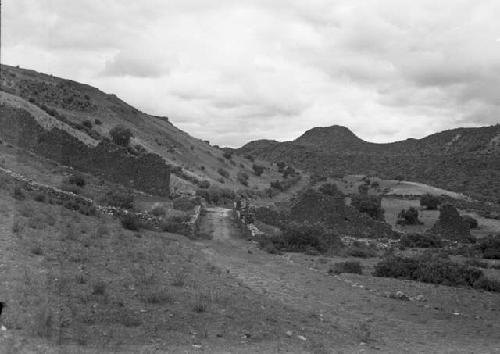 Ancient gateway on east side looking out along walled road to Rumi-Cocla