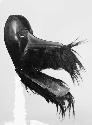 Black wooden mask with fur around snout, Jo la Ge