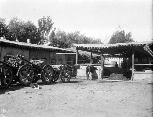 Near Ssu Ko Shu (Shikesu) inn yard, four two-wheel carts lined up