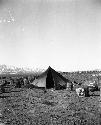 Tent surrounded by supplies