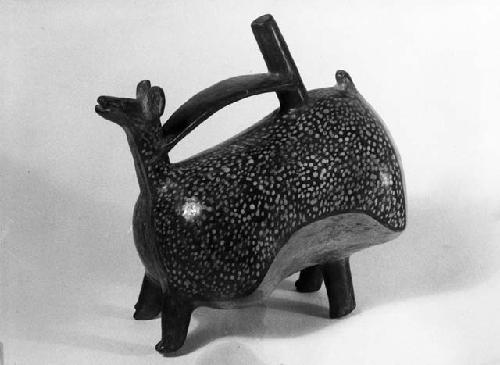 Pottery vessel, animal shaped with handle