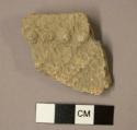Ceramic sherd, rim sherd, four puntations with bulges, textured surface