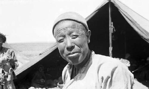 Shearer, portrait head, tent in background