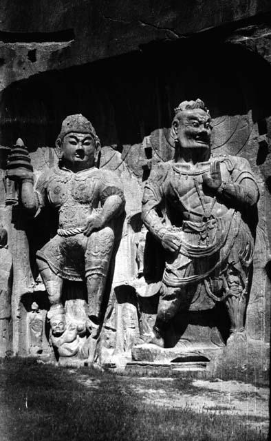 Close-up of two large carved figures