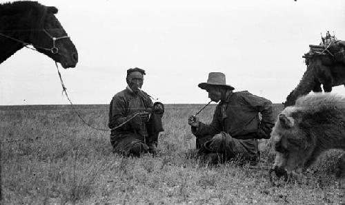 Arash talking and smoking with man met on plains