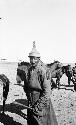 Mongol male with pointed helmet or hat