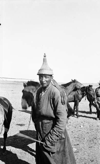 Mongol male with pointed helmet or hat