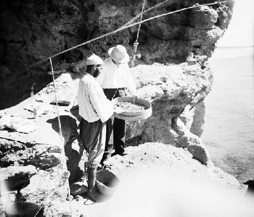 Excavation of Ashakar cave sites, sifting silt