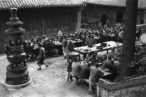 Terrace and incense burner, pilgrims at public meal, T'an Che Ssu, from above