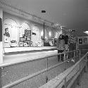 Staff standing by George Peabody exhibit after installation