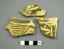 Restorable black-on-yellow potsherd