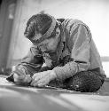 Nathan Jackson at work, carving wood