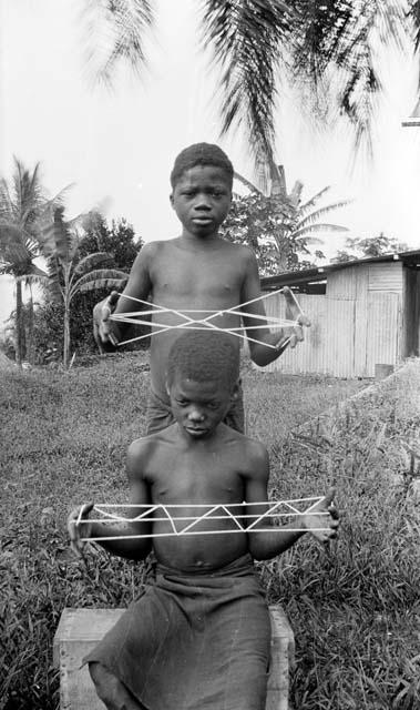 Boys with cat's cradle