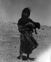 Shammar Bedouin girl with goat at Jumaima