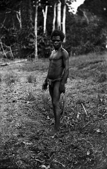 Man standing in clearing