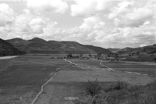 Landscape with river, trees, and hills