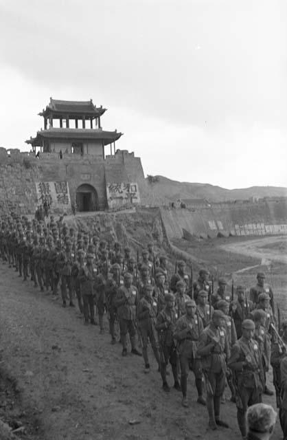 View of long line of marching soldiers