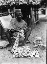 Chief sewing striped cloth