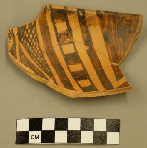 Fragments of Jeddito black on orange pottery bowl