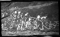 Petroglyph of human and animal figures, handprints