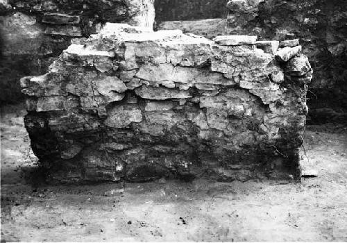 Kiva; masonry deflector from north, showing plaster