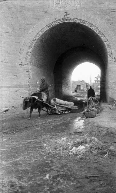 Ox sledge at Chuguchak gate, detailed gate with three reverse swastikas